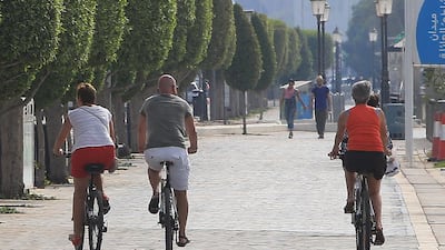 People biking on Corniche to keep healthy life in their busy schedule in Abu Dhabi. Ravindranath K / The National