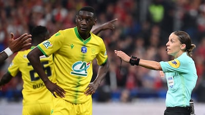 French referee Stephanie Frappart, who will officiate at the World Cup in Qatar, gestures to Nantes defender Molla Wague during the French Cup final between Nice and Nantes at the Stade de France on May 7. AFP