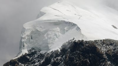 Climbers scale the Breithorn on a warm summer day in Zermatt, Switzerland. Reuters