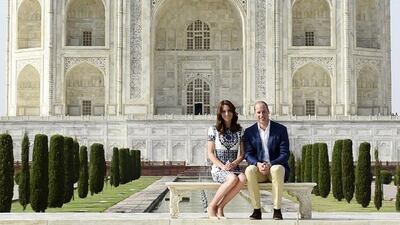 Britain's Prince William and his wife Catherine, the Duchess of Cambridge, pose as they sit in front of the Taj Mahal in Agra, India, April 16, 2016. REUTERS/Money Sharma/Pool