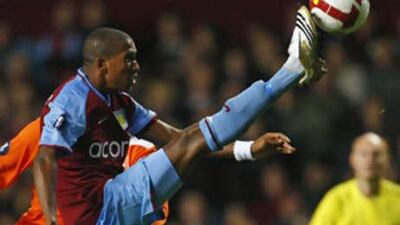 Aston Villa's Ashley Young controls the ball.