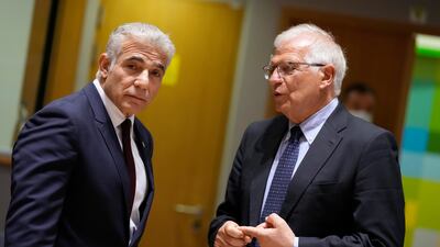 Israeli Foreign Minister Yair Lapid, left, with EU foreign policy chief Josep Borrell after a meeting of EU foreign ministers at the European Council building in Brussels on July 12. AP
