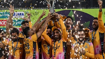 Peshawar Zalmi players lift the PSL trophy after defeating Hyderabad Kingsmen in the final at the Qaddafi Stadium. AFP