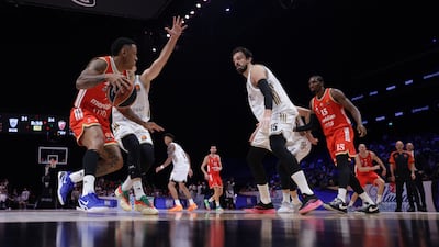 Crvena Zvezda's Yago Dos Santos and Aleksa Avramovic of Dubai Basketball in action. EPA