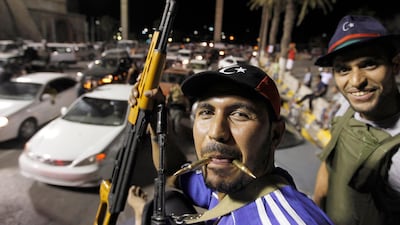 Libyan rebel fighters are seen at green square ,renamed Martyr's square by rebels in Tripoli August 23, 2011. REUTERS/Zohra Bensemra