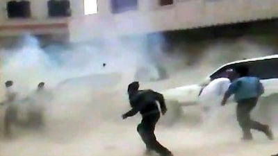 An image grab from footage uploaded to Youtube allegedly shows Syrians running for cover as a roadside bomb explodes in front of a UN observers convoy to Idlib today.