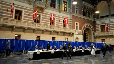 Voters collect their ballot papers at City Hall in Copenhagen. AP