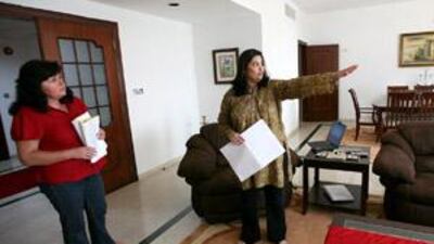 Eva Walters, left, goes over the feng shui analysis of her home with Shivani Adalja.