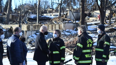 US President Joe Biden and first lady Jill Biden meet with firefighters in Louisville, Colorado. The president's primary legislative initiative, the Build Back Better Act, would funnel billions of dollars to increased forest management, firefighting and efforts to reduce carbon emissions. AFP