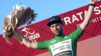 British rider Mark Cavendish on the podium with the points classification leader's green jersey. Claudio Peri / EPA