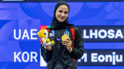 Asma Al Hosani shows off her Asian Games gold medal. UAEJJF