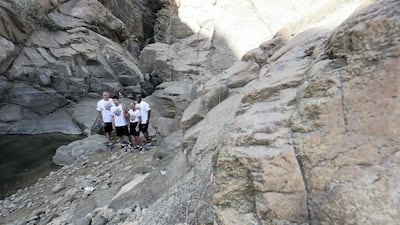 Gary Fournier, Hung Chow, Delia Newman and Allen Jones take the torch on a scenic route through Fujairah. Pawan Singh/The National