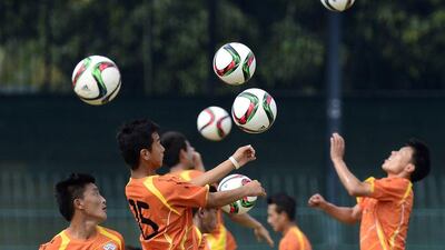 Bhutan football players train on Wednesday ahead of their 2018 World Cup qualifying campaign opener on Thursday against Sri Lanka. Lakruwan Wanniarachchi / AFP / March 11, 2015