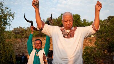 Members of the Khoe and San tribe pray. Stefan Heunis / AFP Photo