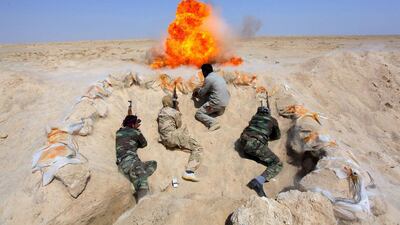 Shi’ite fighters, who have joined the Iraqi army to fight against militants of the Islamic State, formerly known as the Islamic State of Iraq and the Levant (ISIL), take part in field training in the desert in the province of Najaf. Alaa Al-Marjani / Reuters
