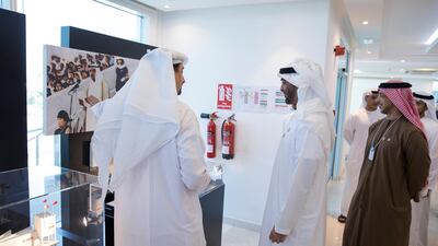Sheikh Mohammed bin Zayed, Crown Prince of Abu Dhabi and Deputy Supreme Commander of the UAE Armed Forces (C), visits the Expo 2020 main office in Jebel Ali. He is seen with Sheikh Mansour bin Zayed, UAE Deputy Prime Minister and Minister of Presidential Affairs (R). Hamad Al Mansoori for The Crown Prince Court