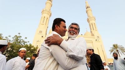 Worshippers at Jumeirah Mosque in Dubai greet each other after Eid Al Adha prayers in 2018. Pawan Singh / The National