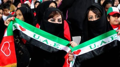 Supporters of the United Arab Emirates (UAE) wave scarfs prior the start of the Gulf Cup's final football match between UAE and Iraq on January 18, 2013 in Manama. Marwan Naamani / AFP