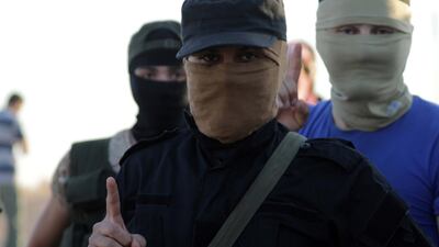 Islamist rebels from Hayat Tahrir Al Sham outside the Syrian villages of Al Foua and Kefraya in July 2018. Reuters