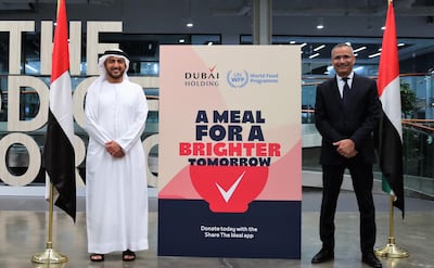 Dubai Holding managing director Khalid Al Malik (Dubai Holding Managing Director), left, with Mageed Yahia, director of World Food Programme UAE office and representative to the GCC, as they launch the A Meal for a Brighter Tomorrow campaign. Courtesy Dubai Holding