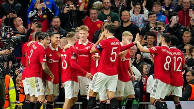 Cristiano Ronald celebrates with the United players. AP