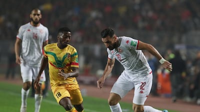 Tunisia's Ali Maaloul under pressure from Abdoulaye Diaby of Mali. EPA