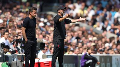 Fulham coach Marco Silva, left, and Liverpool manager Jurgen Klopp watch the action. AP