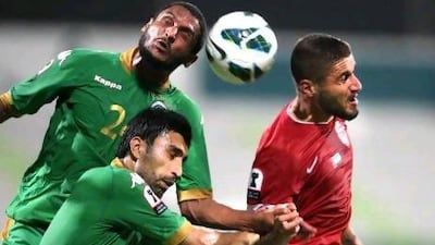 Al Ahli, in red, were down to nine men by the end of their 1-1 draw in Dubai. Jaime Puebla / The National