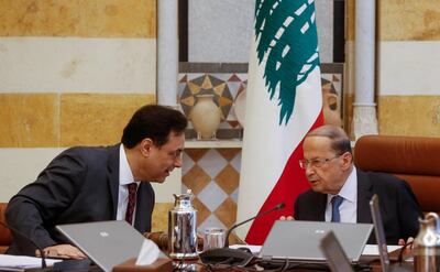 Lebanon's Prime Minister Hassan Diab, left, with President Michel Aoun, during a cabinet meeting. Reuters