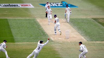New Zealand's Ross Taylor takes a catch to dismiss England batsman Ben Stokes. AFP