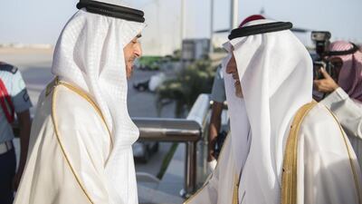 Sheikh Mohammed bin Zayed, Crown Prince of Abu Dhabi and Deputy Supreme Commander of the Armed Forces, left, greets Prince Khalid bin Faisal bin Abdulaziz Al Saud, Governor of Makkah Region of Saudi Arabia, right, upon arriving at King Abdulaziz International Airport. Hamad Al Kaabi / Crown Prince Court - Abu Dhabi
