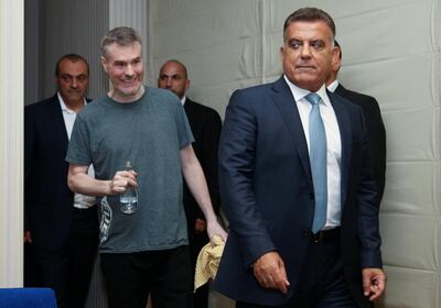 Kristian Lee Baxter walks next to Lebanese security chief Major General Abbas Ibrahim in Beirut on August 9, 2019. Reuters