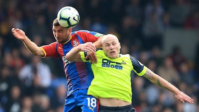 Aaron Mooy of Huddersfield Town competes for a header with James McArthur of Crystal Palace. Getty Images