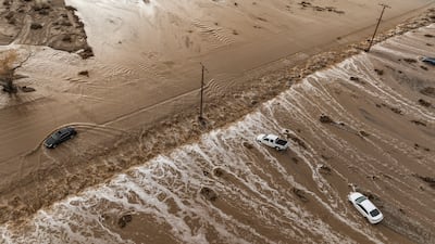 Stranded vehicles as floodwaters wash out East Palmdale Boulevard in Sun Village, California. EPA