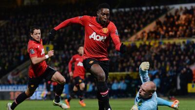 Manchester United's Danny Welbeck scores past Norwich City goalkeeper John Ruddy on Saturday. Ben Stansall / AFP