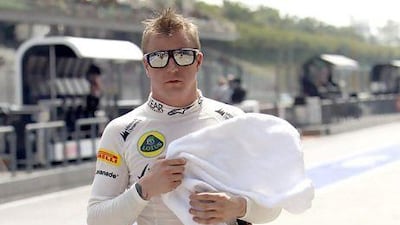 Lotus Formula One driver Kimi Raikkonen of Finland walks in the pit after the second practice session of the Malaysian F1 Grand Prix at Sepang International Circuit outside Kuala Lumpur, March 22, 2013. REUTERS/Edgar Su (MALAYSIA - Tags: SPORT MOTORSPORT F1) *** Local Caption *** SGP87_MOTOR-RACING-_0322_11.JPG