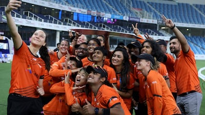 Falcons' players pose for a selfie after the FairBreak Invitational women’s T20 final against the Tornadoes at the Dubai International Stadium on Sunday, May 15, 2022. AFP