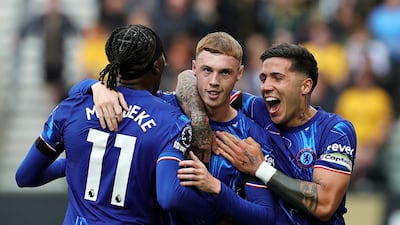 Cole Palmer of Chelsea celebrates scoring his team's second goal with Noni Madueke and Enzo Fernandez. Getty Images