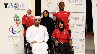 Maryam Al Dhanhani, flanked by her UAE team mates: shot putters Thekra Al Kaabi and Mohammed Al Kaabi; shooter Saif Al Nuaimi; and shot putter Noura Al Ketby, both seated. Chris Whiteoak/ The National
