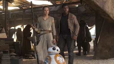Daisy Ridley and John Boyega in a scene from Star Wars: The Force Awakens. Courtesy Lucasfilm Ltd
