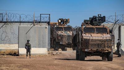 Turkish military vehicles enter northern Syria to take part in a joint patrol with Russian troops in 2021. Turkish President Recep Tayyip Erdogan has pledged to begin an operation against Syrian-Kurdish fighters in the region. AFP