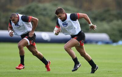 Henry Slade, right, sprints with his centre partner Jonathan Joseph during the England training session held at Pennyhill Park. David Rogers / Getty Images