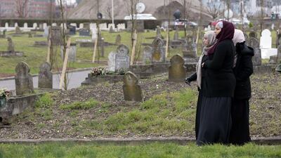 Women looks on during a funeral ceremony of French police officer Ahmed Merabet, in Bobigny, near Paris, after he was killed on January 7 by Islamist gunmen during the attack of French satirical newspaper Charlie Hebdo. Joel Saget / AFP