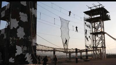 Syrian police cadets display their skills during a graduation ceremony on the outskirts of Damascus, Syria. AFP
