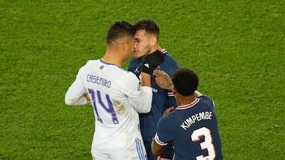 Real Madrid's Casemiro and PSG's Leandro Paredes square up. AFP