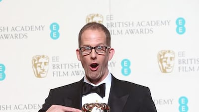 Director Pete Docter after poses for photographers with his Best Animated Film award for Inside Out backstage. Joel Ryan / Invision / AP