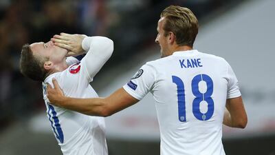 Wayne Rooney celebrates his 50th international goal for England with teammate Harry Kane during a 2-0 Euro 2016 qualifying win over Switzerland on Tuesday. Eddie Keogh / Reuters / September 8, 2015