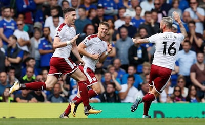 Burnley's Stephen Ward, left, celebrates scoring a goal against Chelsea. Kirsty Wigglesworth / AP Photo