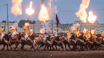 Riders add rifle fire to their horseback skills at the Moussem gathering in Rabat, Morocco's capital.