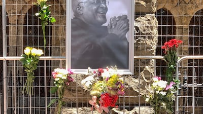 A portrait of Desmond Tutu outside St George's cathedral in Cape Town. AFP
